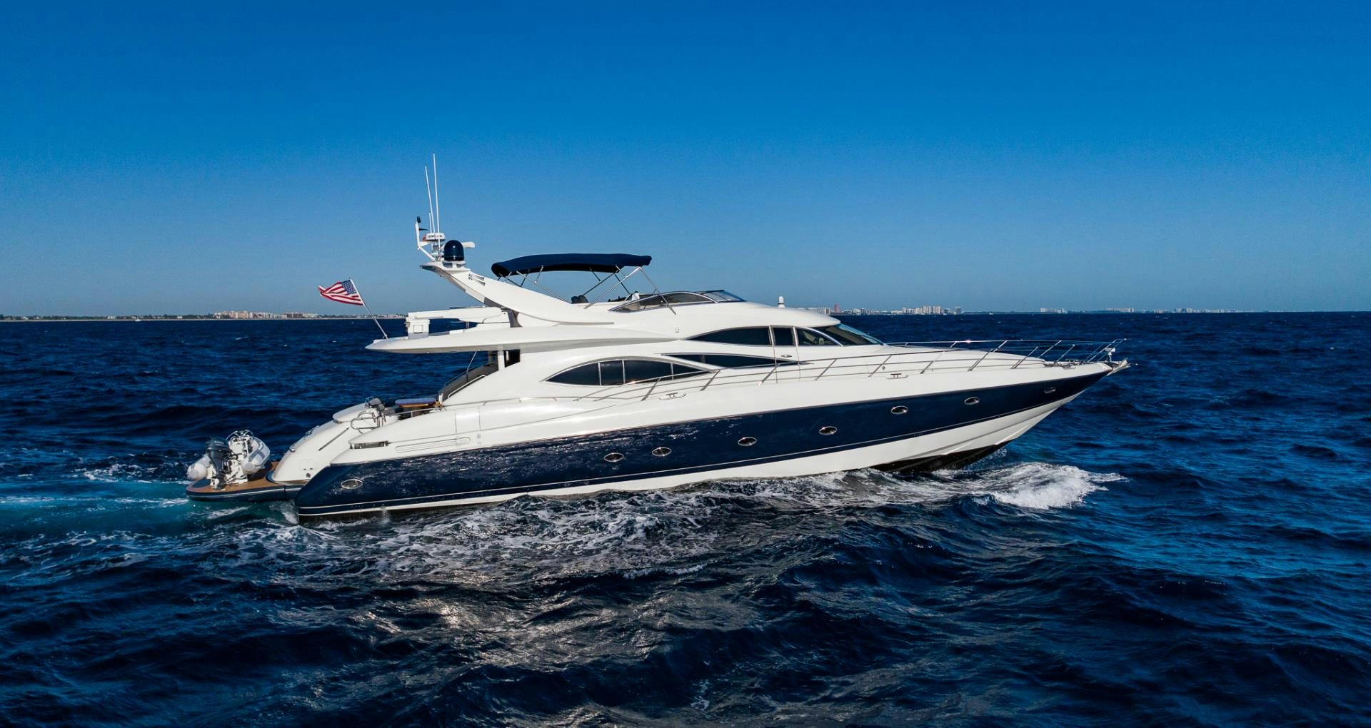 a white yacht in the water aboard SIROCCO Yacht for Sale
