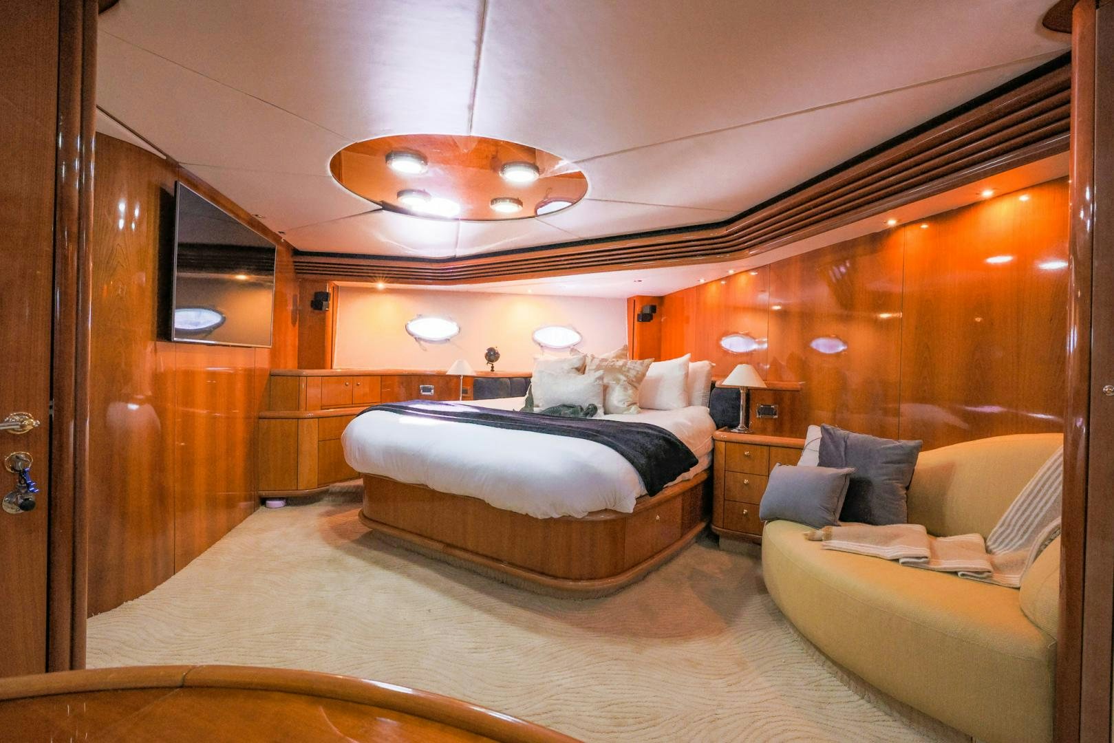 a large bed in a room aboard SIROCCO Yacht for Sale
