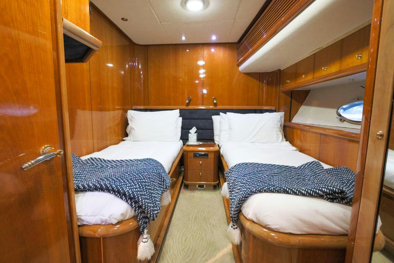 a room with a couple beds aboard SIROCCO Yacht for Sale