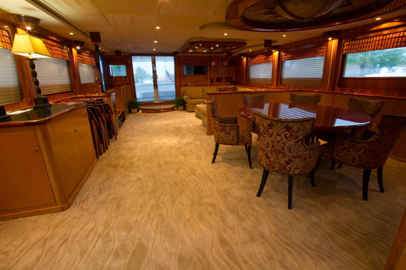 a room with a table and chairs aboard GLEN ELLEN Yacht for Sale