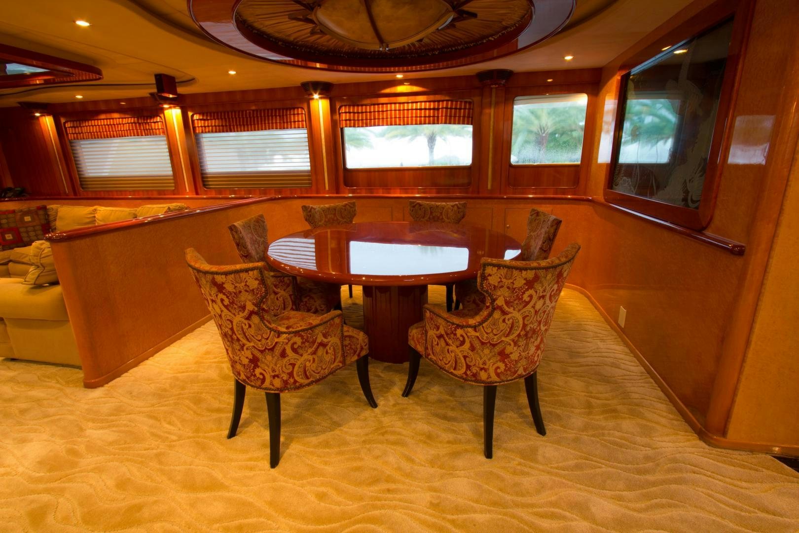 a room with a table and chairs aboard GLEN ELLEN Yacht for Sale