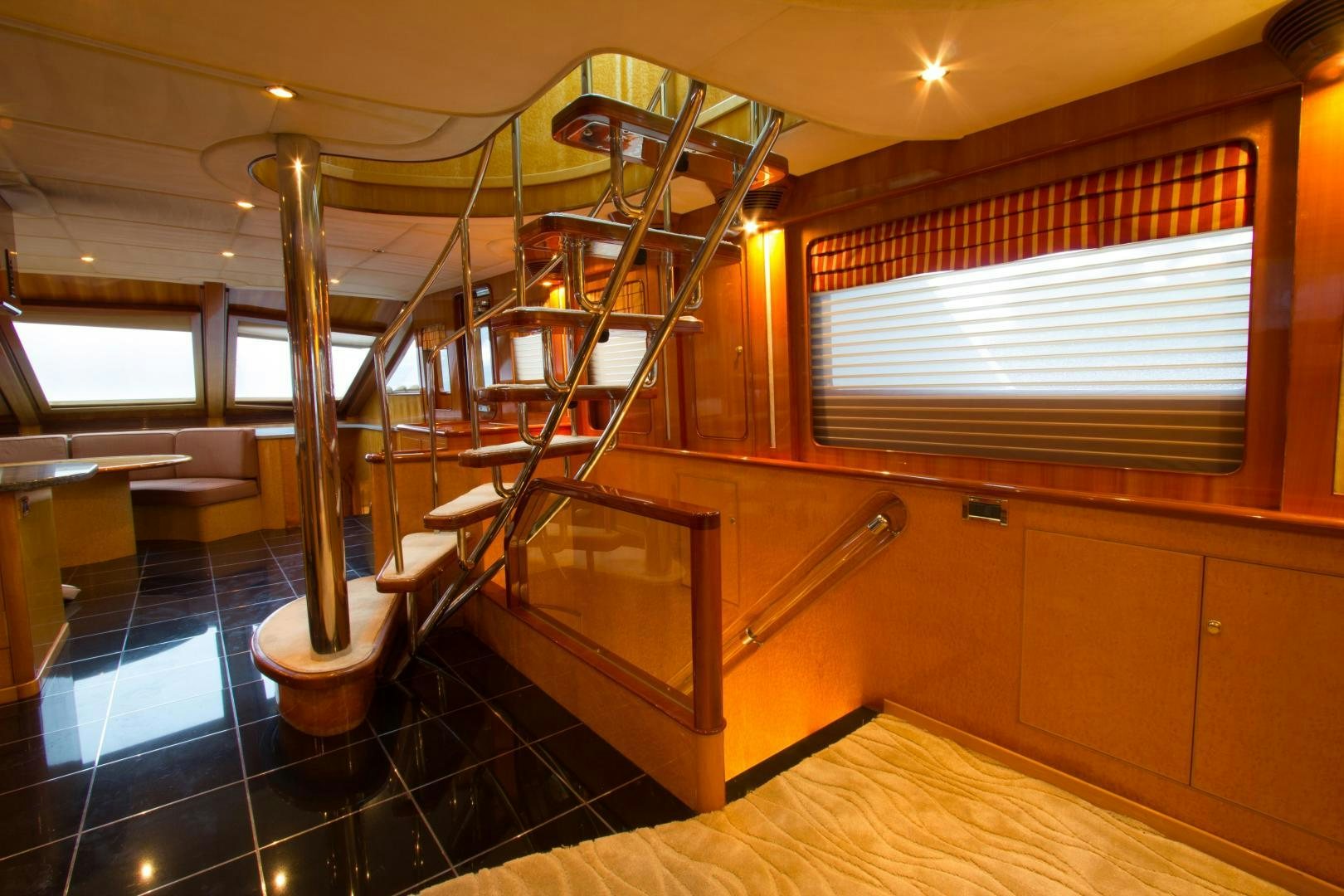 a room with a staircase and a window aboard GLEN ELLEN Yacht for Sale