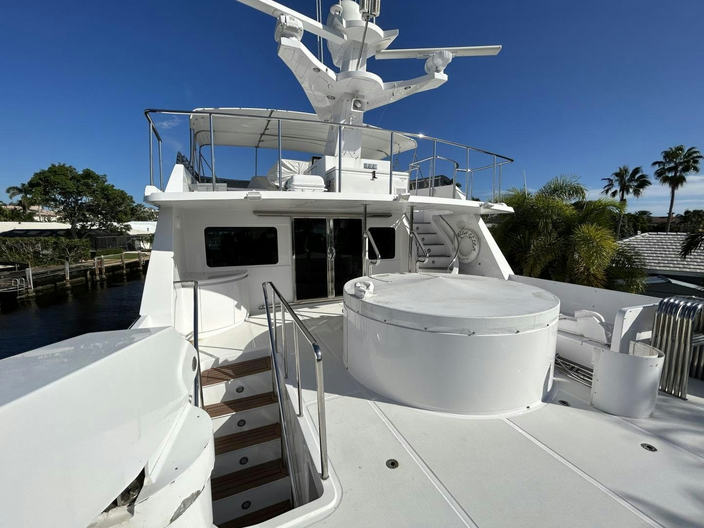 a white boat on a deck aboard GLEN ELLEN Yacht for Sale