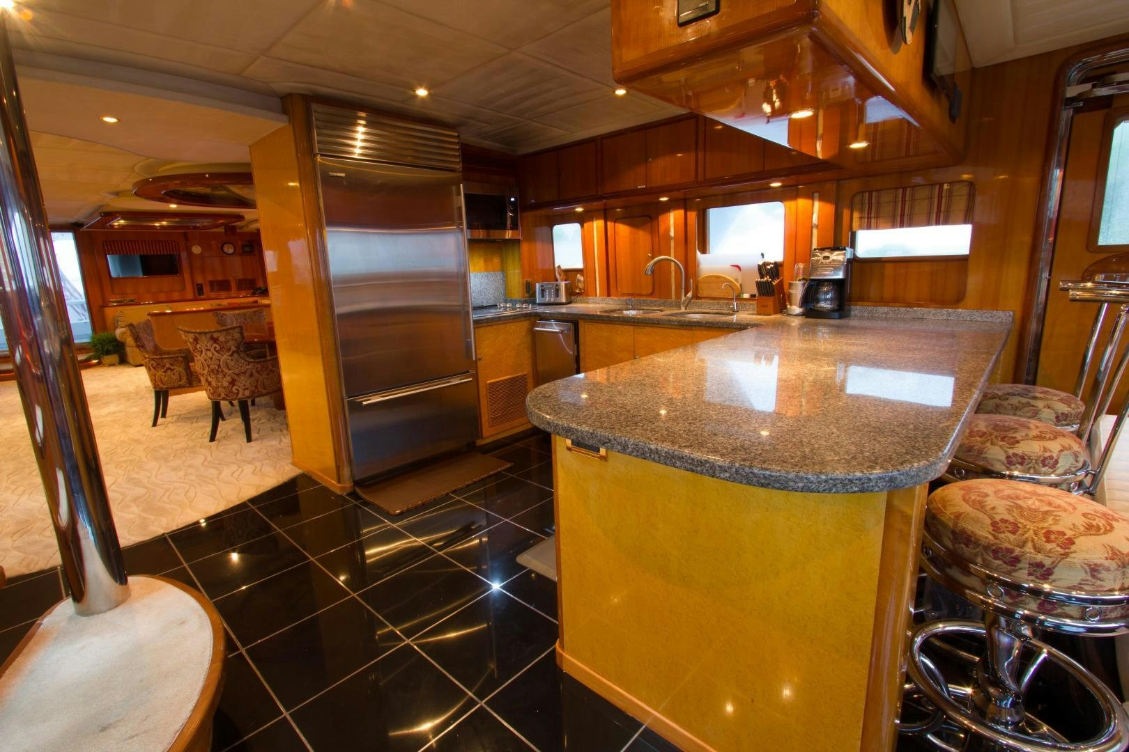 a kitchen with a large island aboard GLEN ELLEN Yacht for Sale