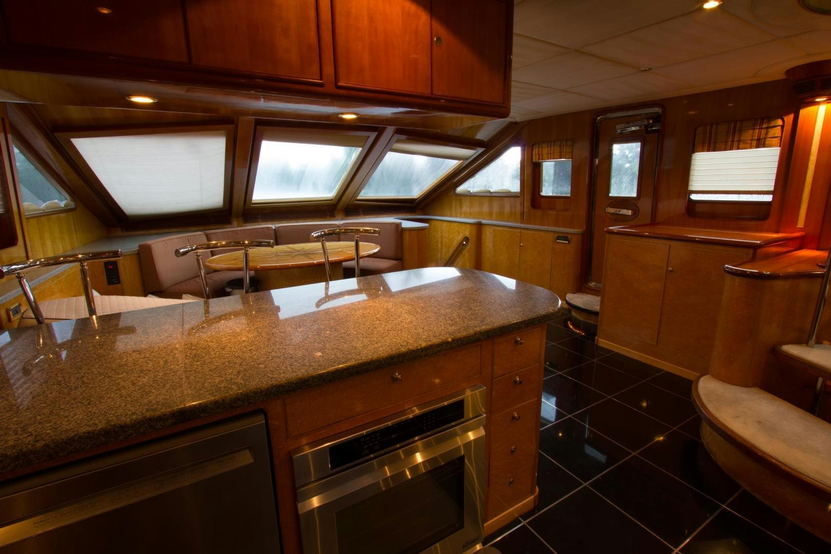 a kitchen with a large island aboard GLEN ELLEN Yacht for Sale