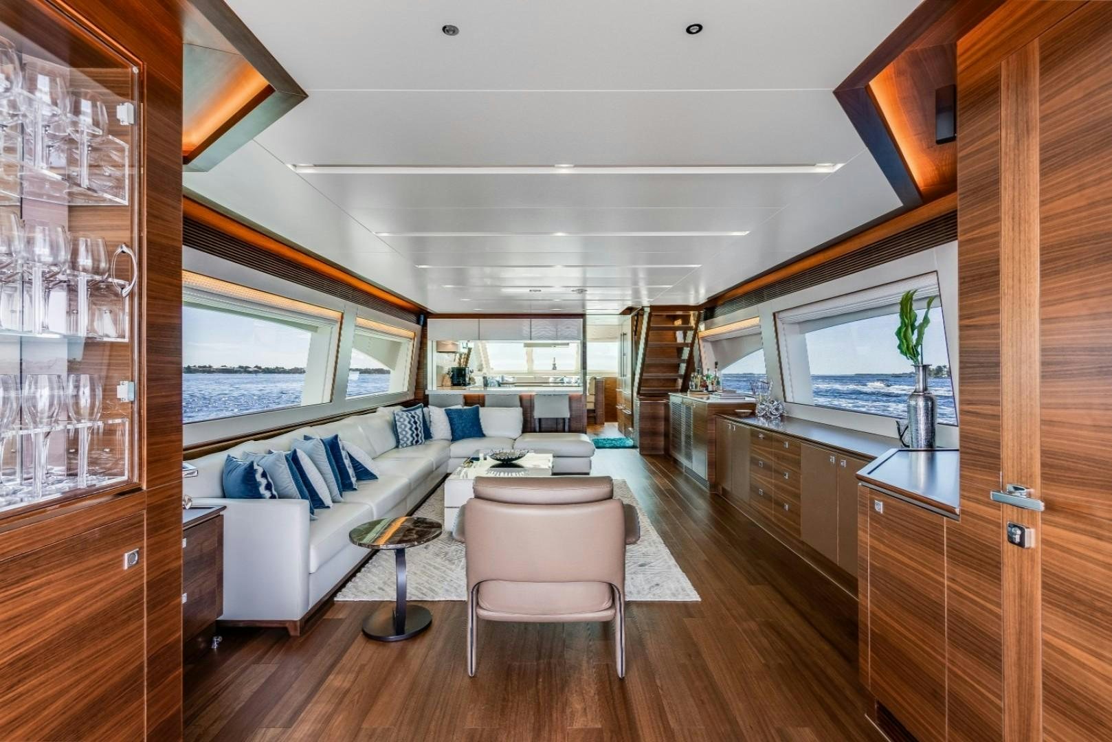 a living room with a wood floor aboard TI AMO Yacht for Sale