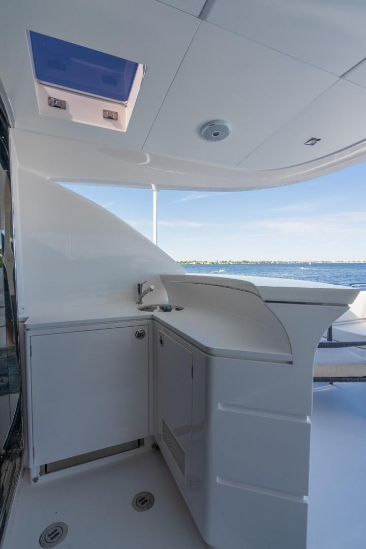 a white room with a sink and a large window aboard TI AMO Yacht for Sale