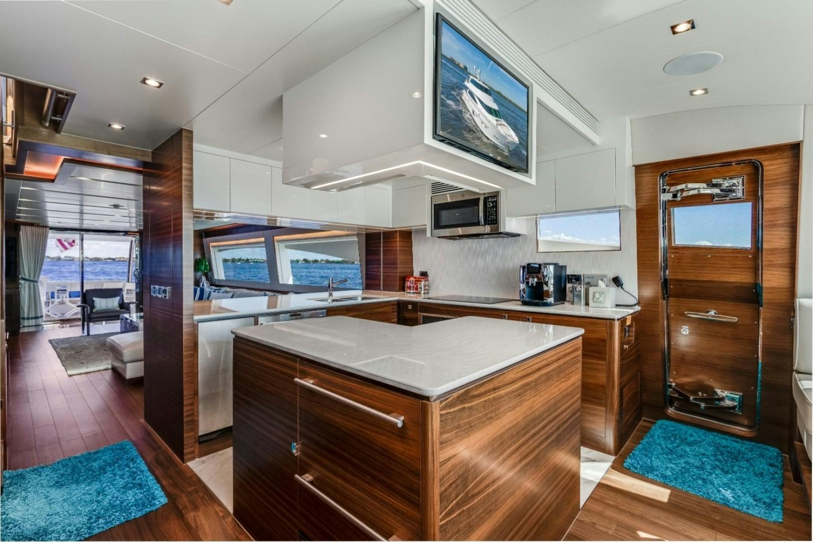 a kitchen with a large island aboard TI AMO Yacht for Sale