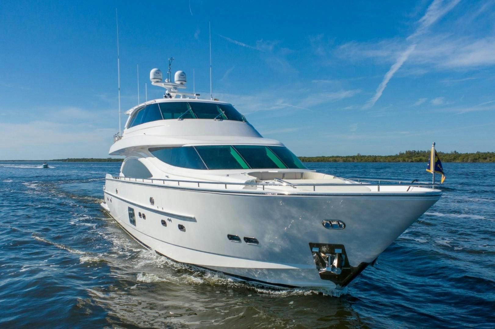 a white yacht on the water aboard TI AMO Yacht for Sale