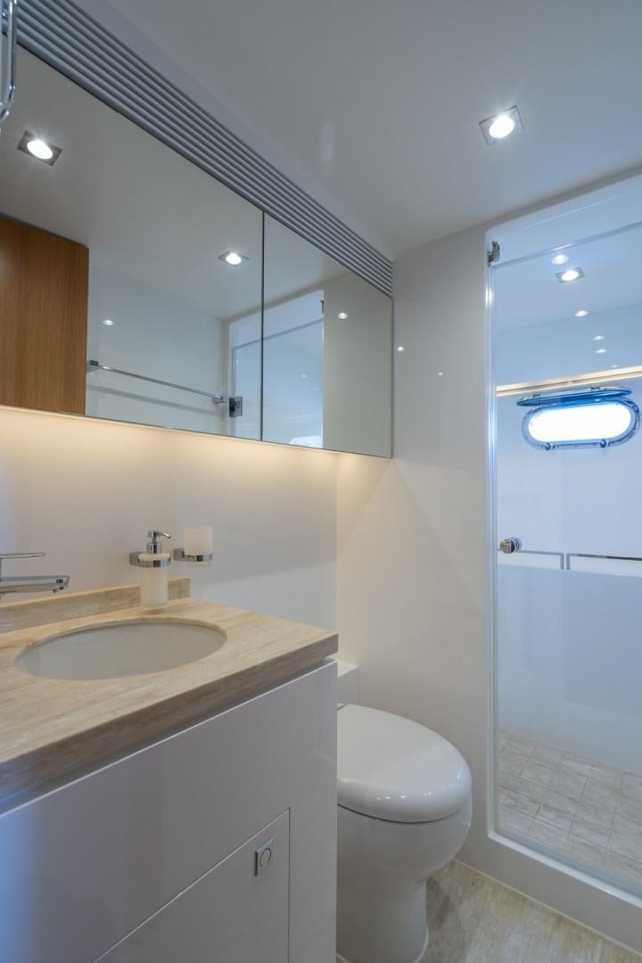 a bathroom with a sink and a toilet aboard TI AMO Yacht for Sale
