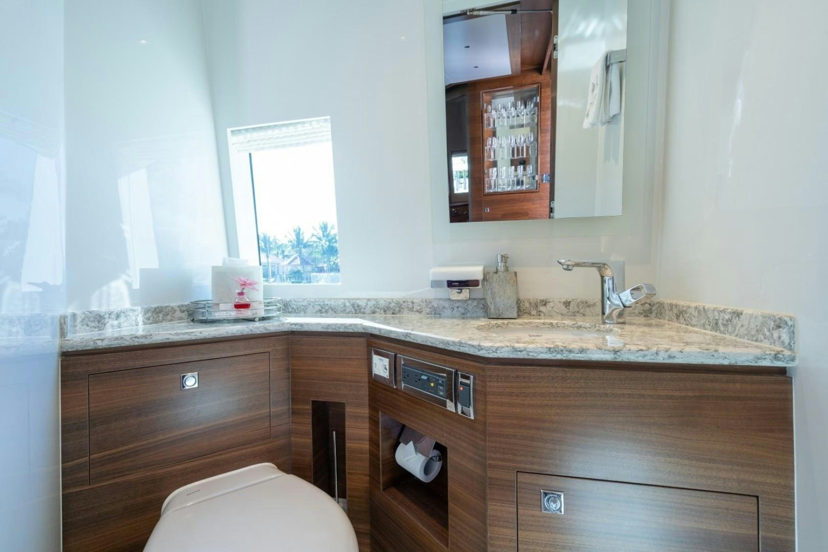 a bathroom with a sink and a toilet aboard TI AMO Yacht for Sale