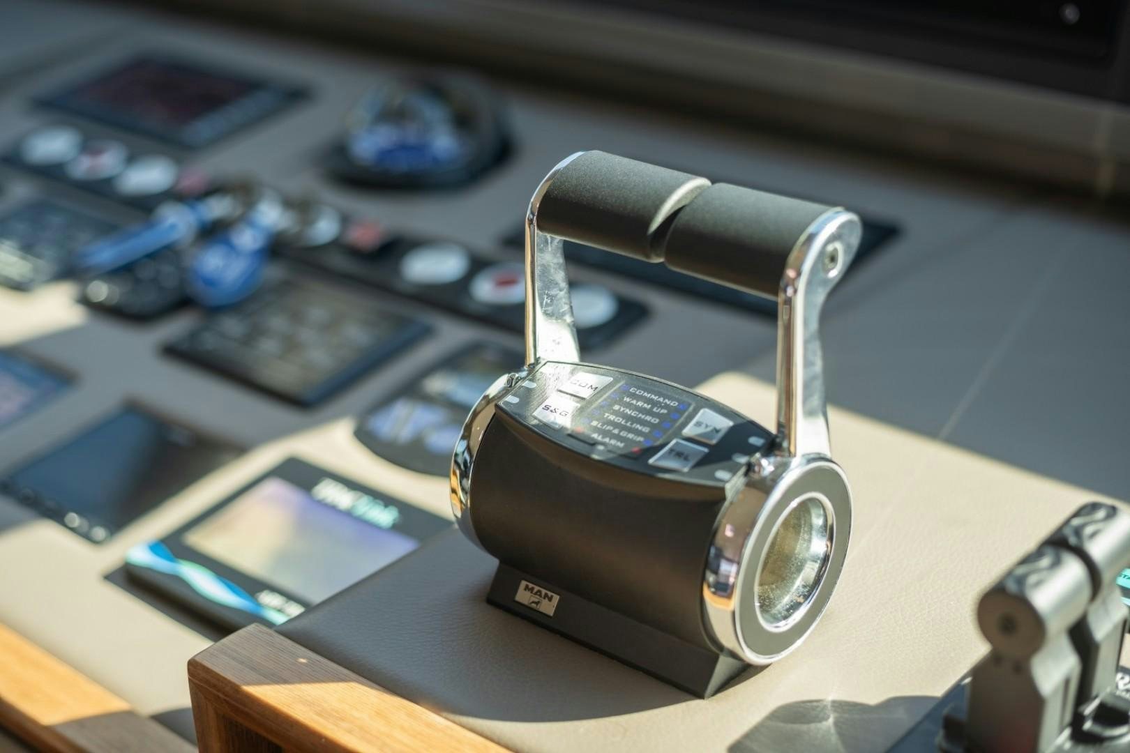 a key chain on a table aboard TI AMO Yacht for Sale