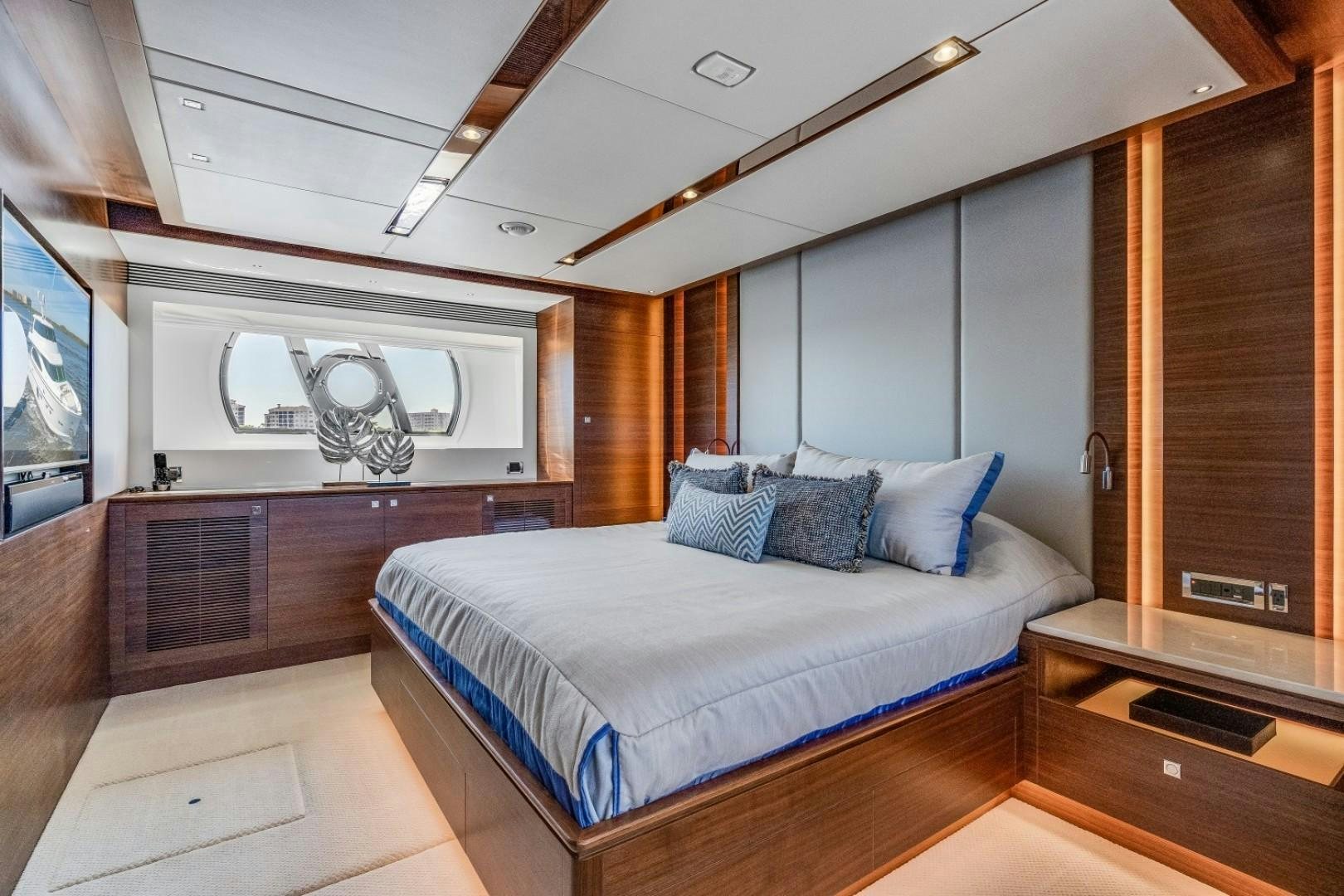 a large bedroom with a large bed aboard TI AMO Yacht for Sale