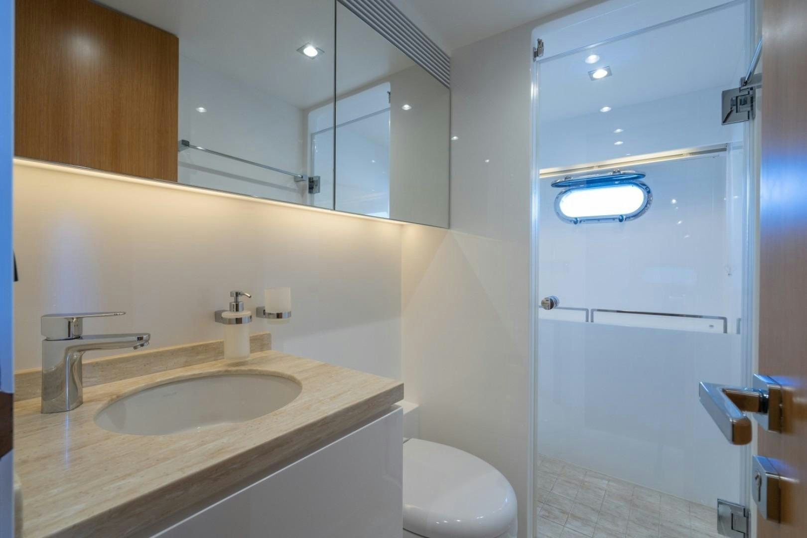 a bathroom with a sink and a toilet aboard TI AMO Yacht for Sale