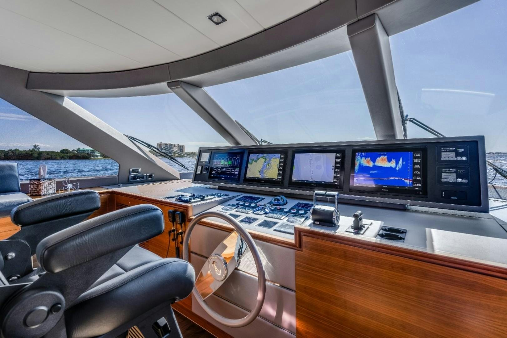 a room with many monitors aboard TI AMO Yacht for Sale
