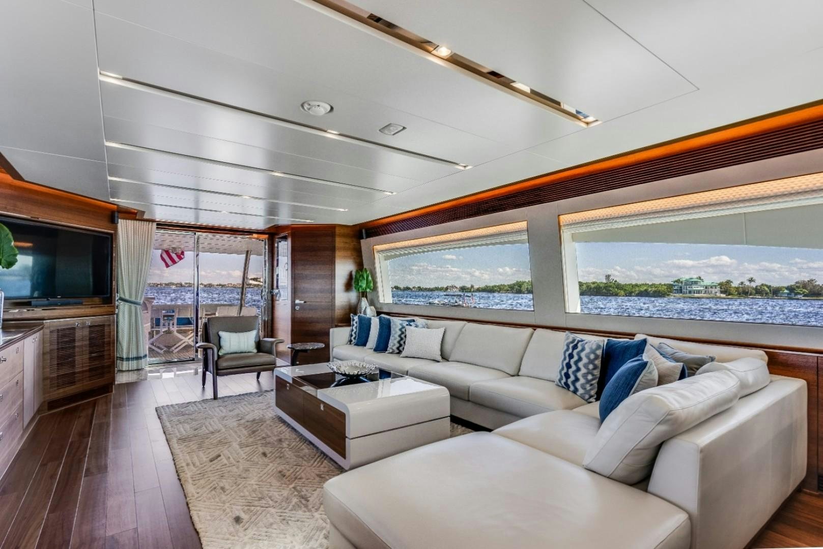 a living room with a large window aboard TI AMO Yacht for Sale