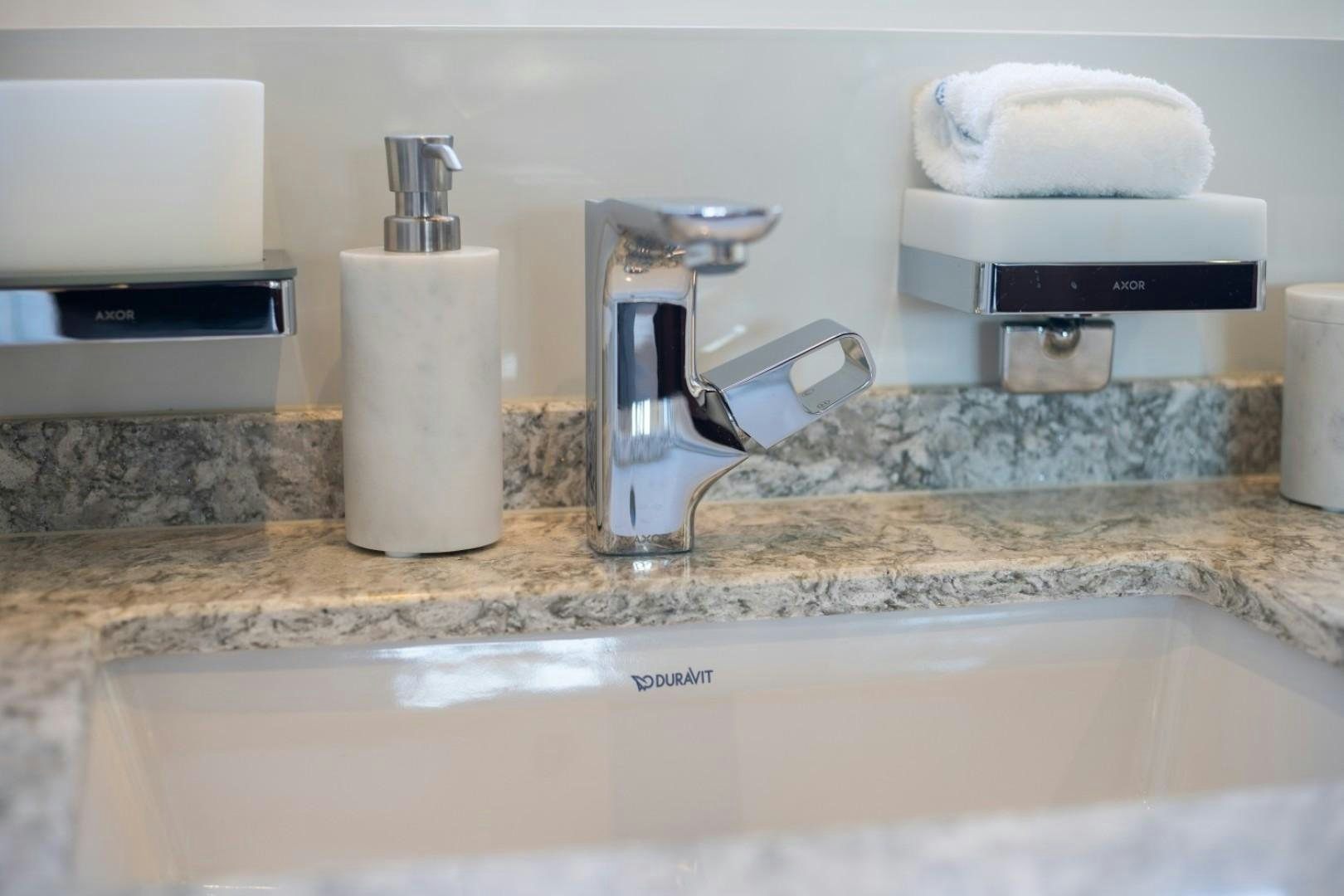 a kitchen counter with a faucet and a sink aboard TI AMO Yacht for Sale