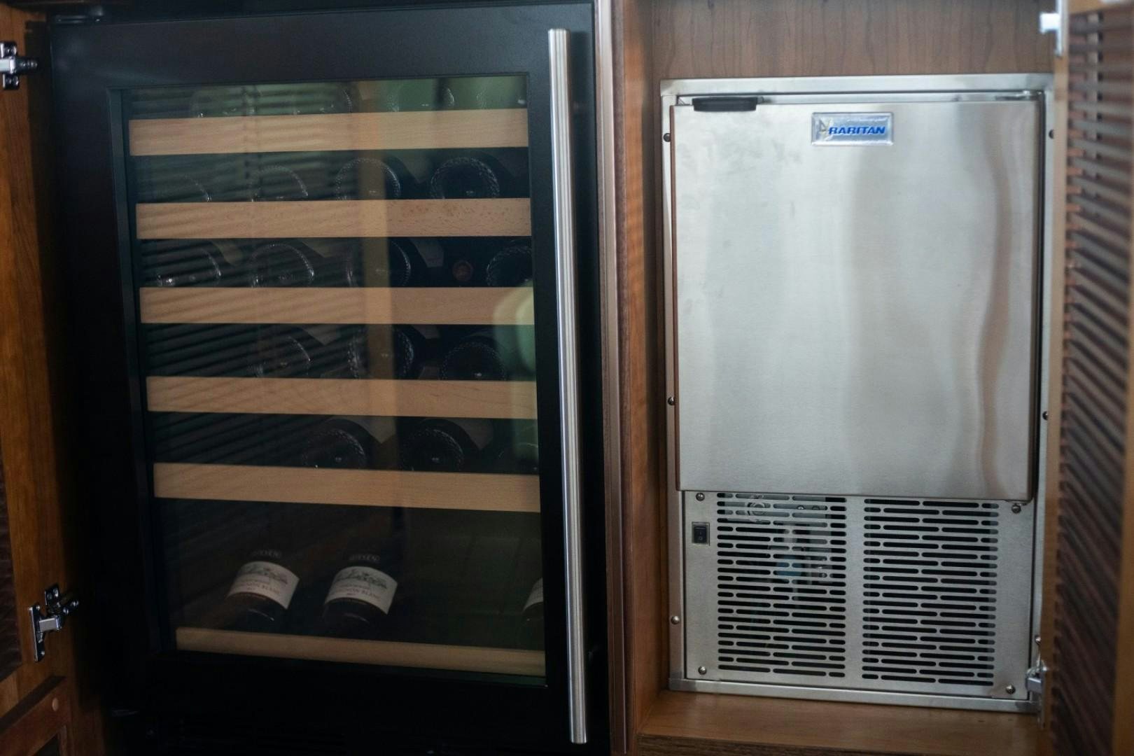 a refrigerator with a door open aboard TI AMO Yacht for Sale