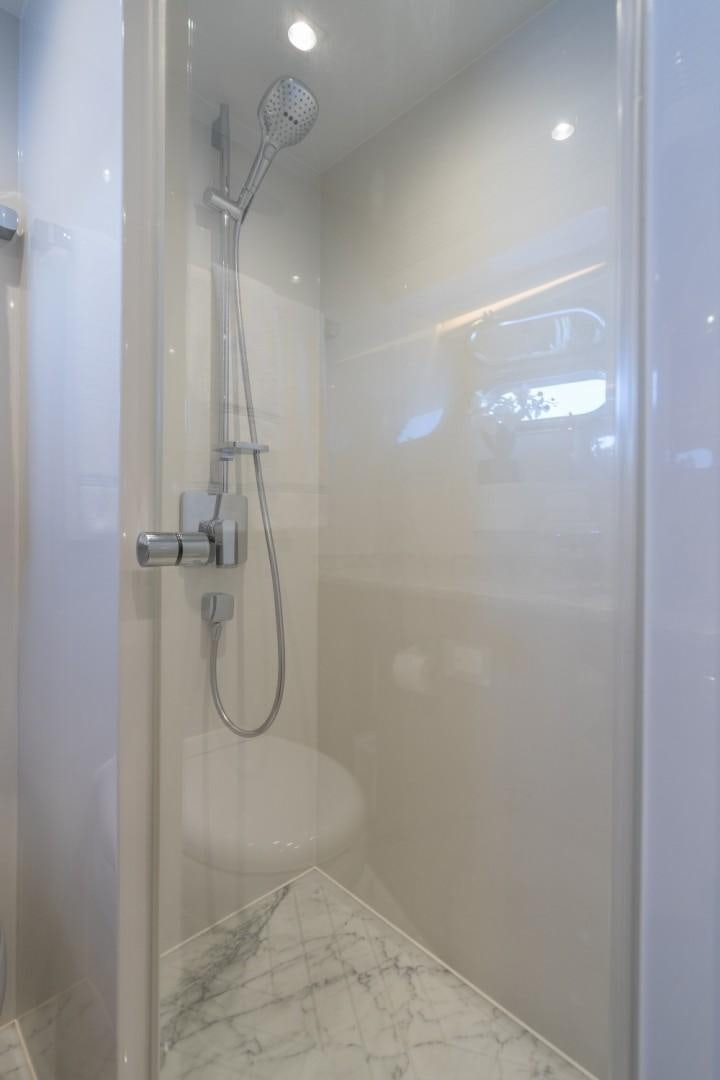 a shower unit with a glass door aboard TI AMO Yacht for Sale