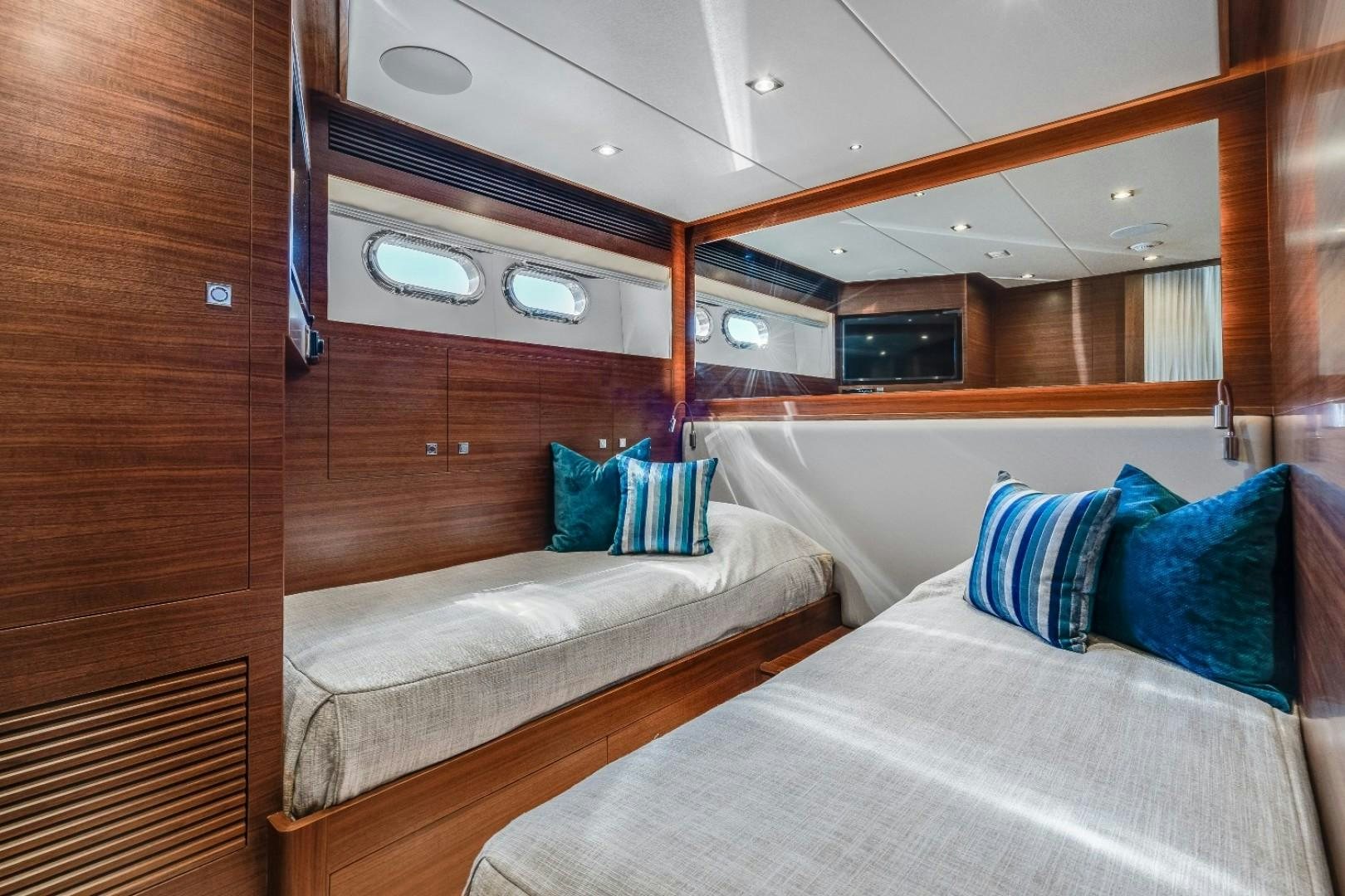 a room with two beds aboard TI AMO Yacht for Sale