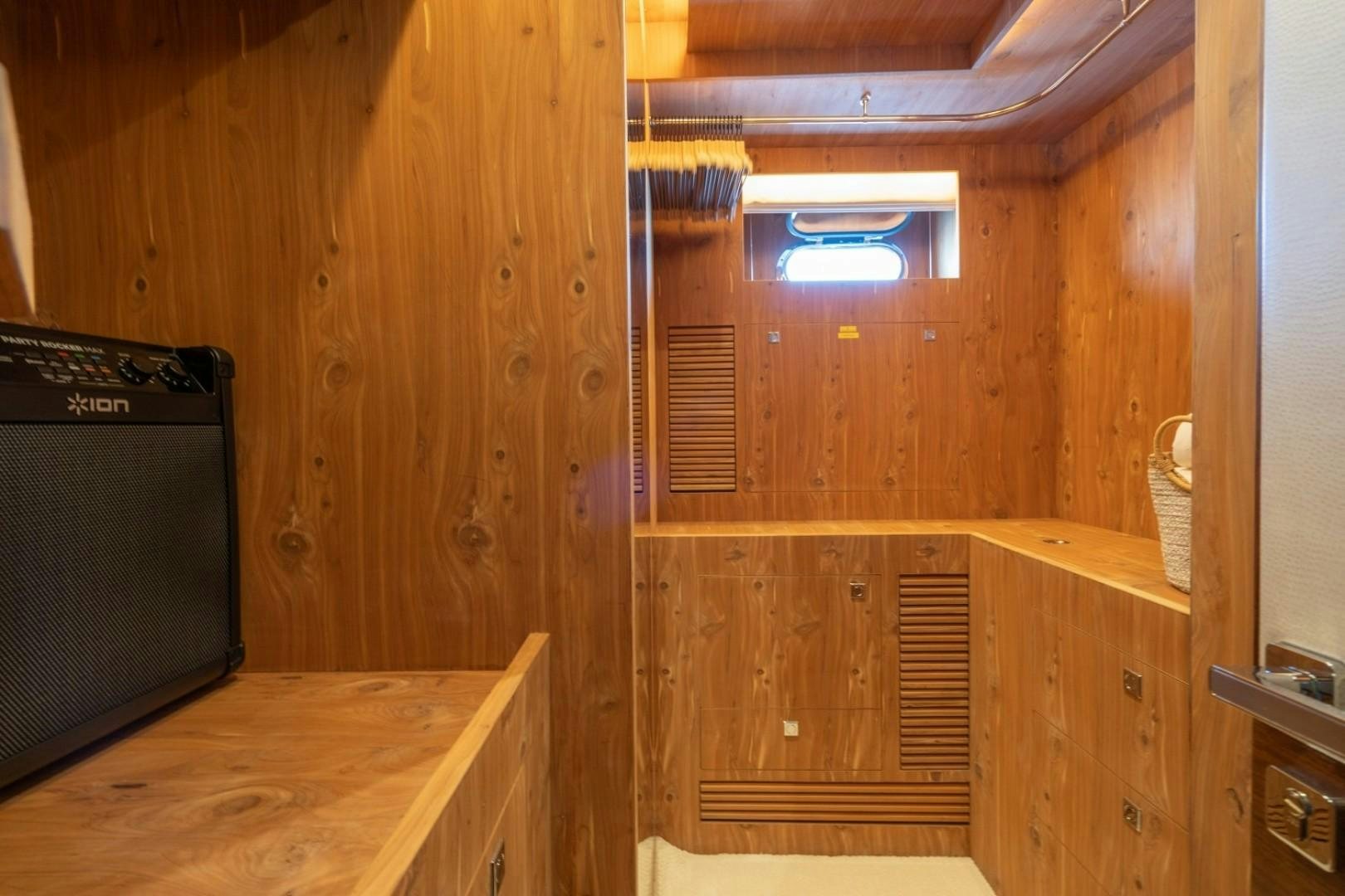 a room with a tv and a shelf with a computer aboard TI AMO Yacht for Sale