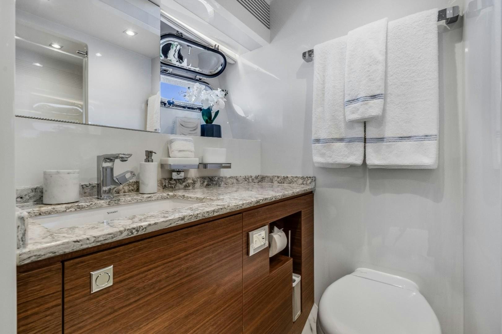 a bathroom with a sink and toilet aboard TI AMO Yacht for Sale