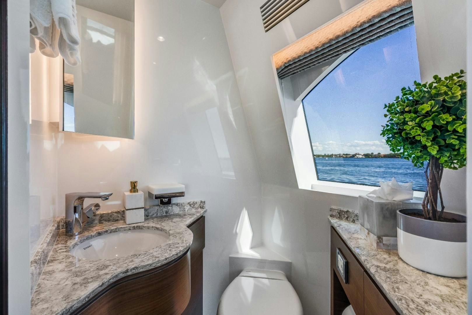 a bathroom with a sink and a toilet aboard TI AMO Yacht for Sale