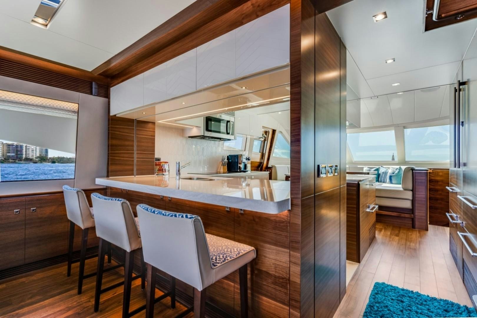 a kitchen with a large island aboard TI AMO Yacht for Sale