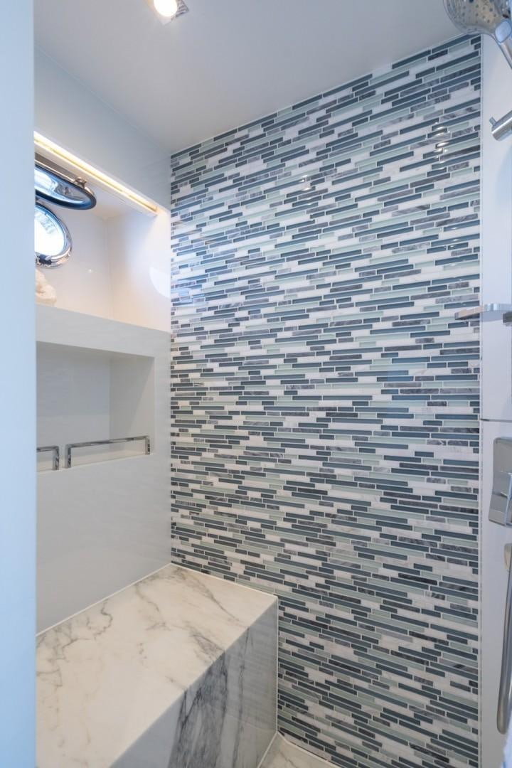 a white tiled wall aboard TI AMO Yacht for Sale