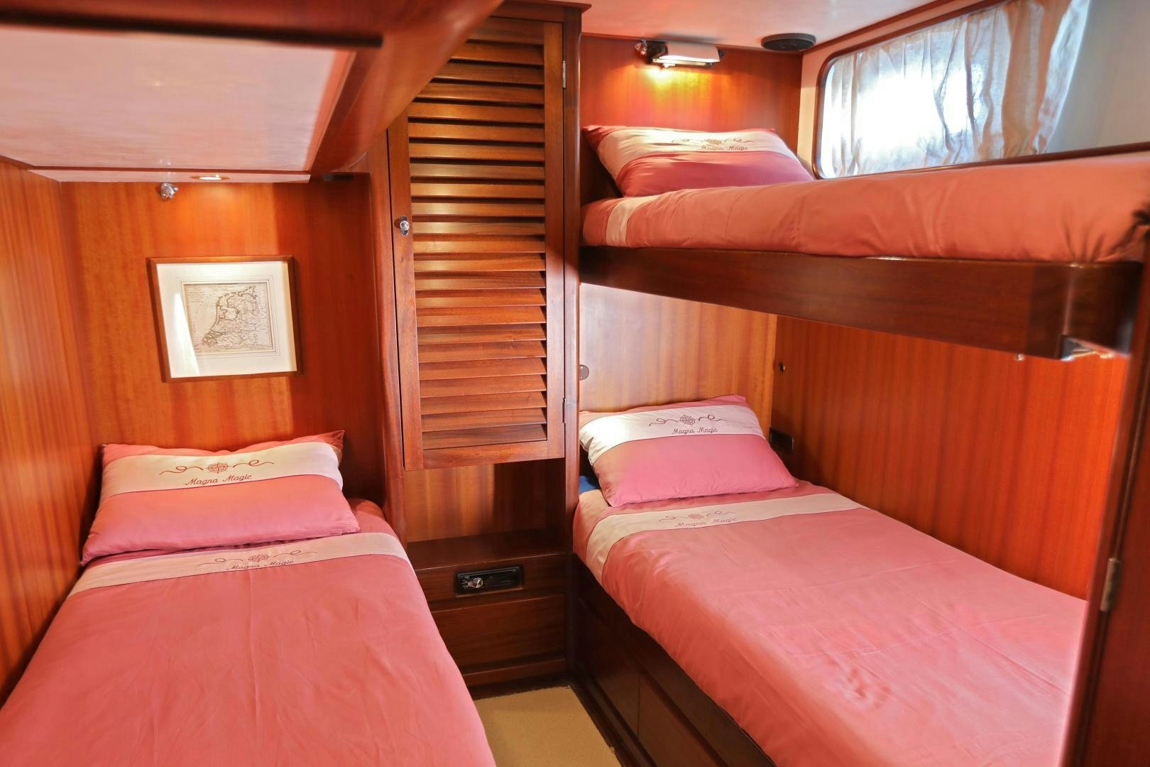 a couple of beds in a room aboard IRON MONKEY Yacht for Sale