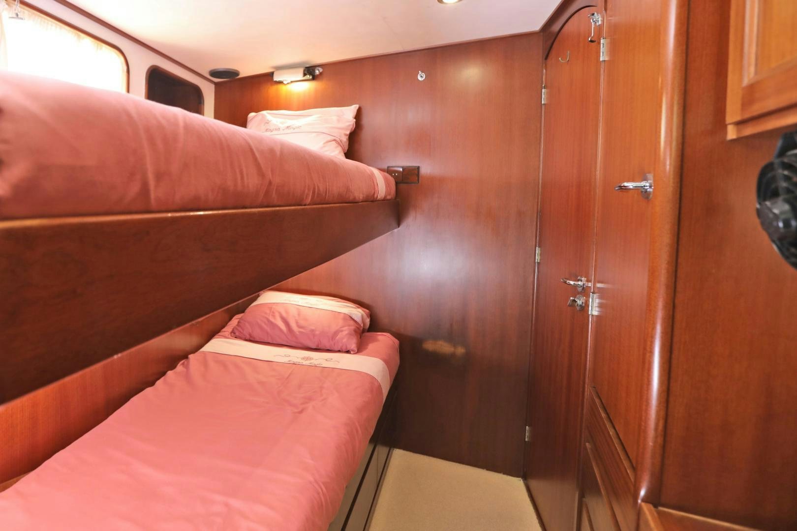 a bed in a room aboard IRON MONKEY Yacht for Sale
