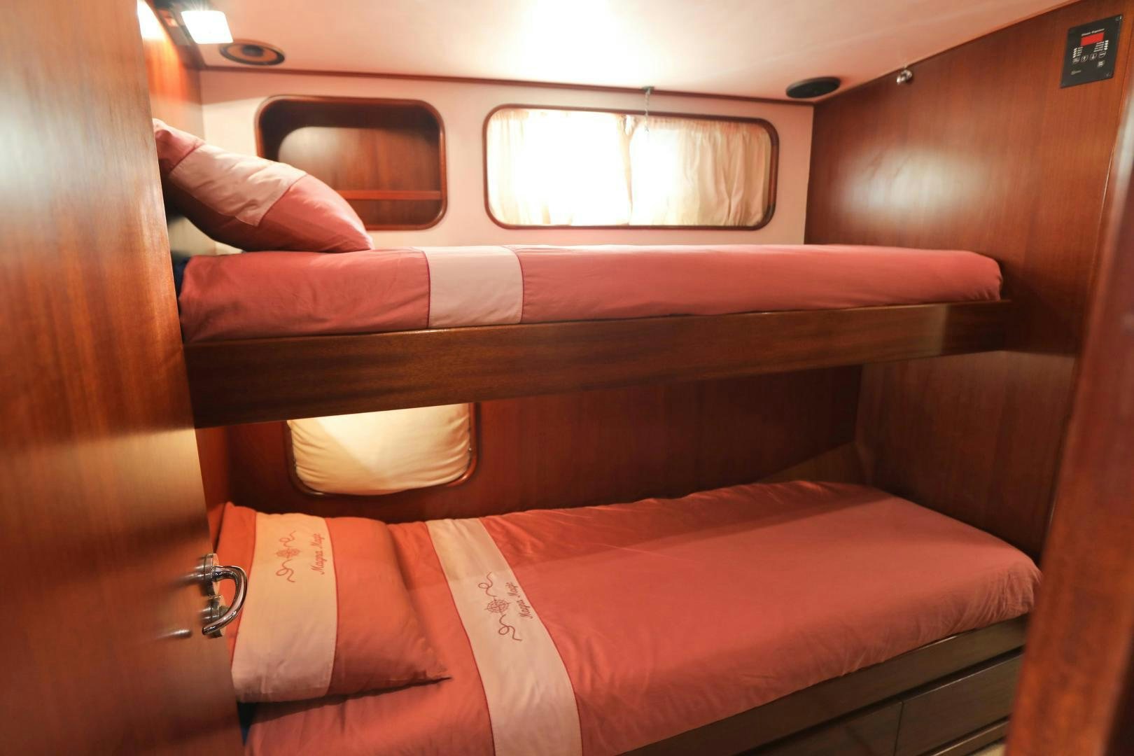 a couch with a seat aboard IRON MONKEY Yacht for Sale