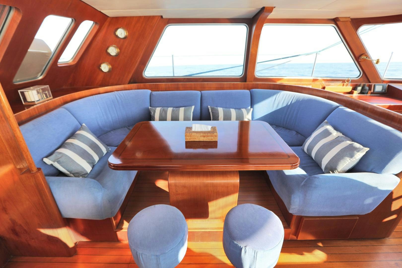 a room with a couch and a table aboard IRON MONKEY Yacht for Sale