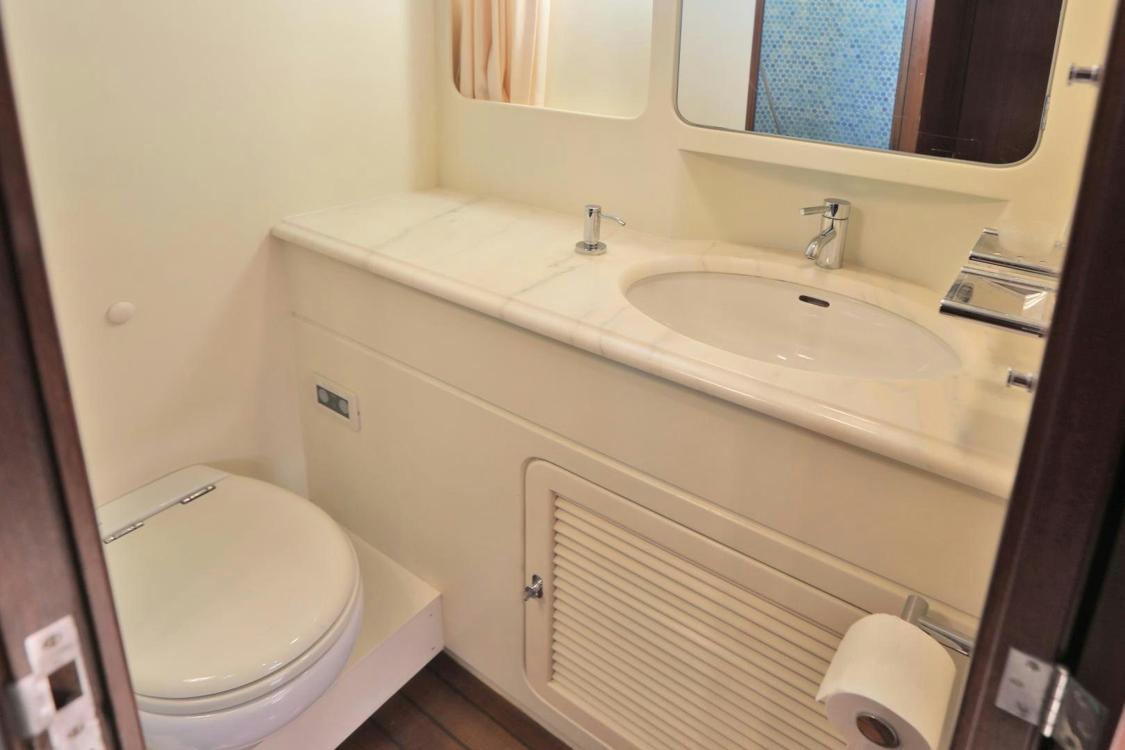 a bathroom with a sink and toilet aboard IRON MONKEY Yacht for Sale
