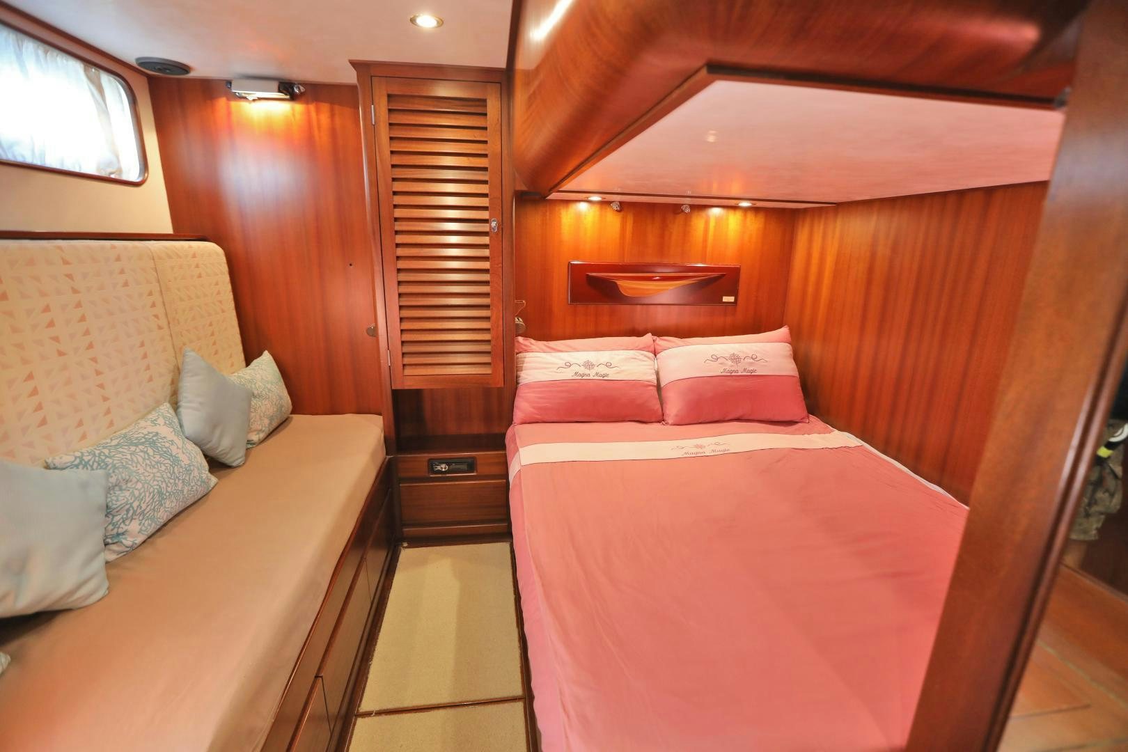 a couple of beds in a cabin aboard IRON MONKEY Yacht for Sale
