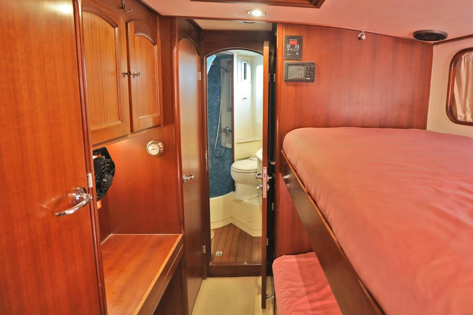 a pink hotel room with a pink bed and a pink bed aboard IRON MONKEY Yacht for Sale