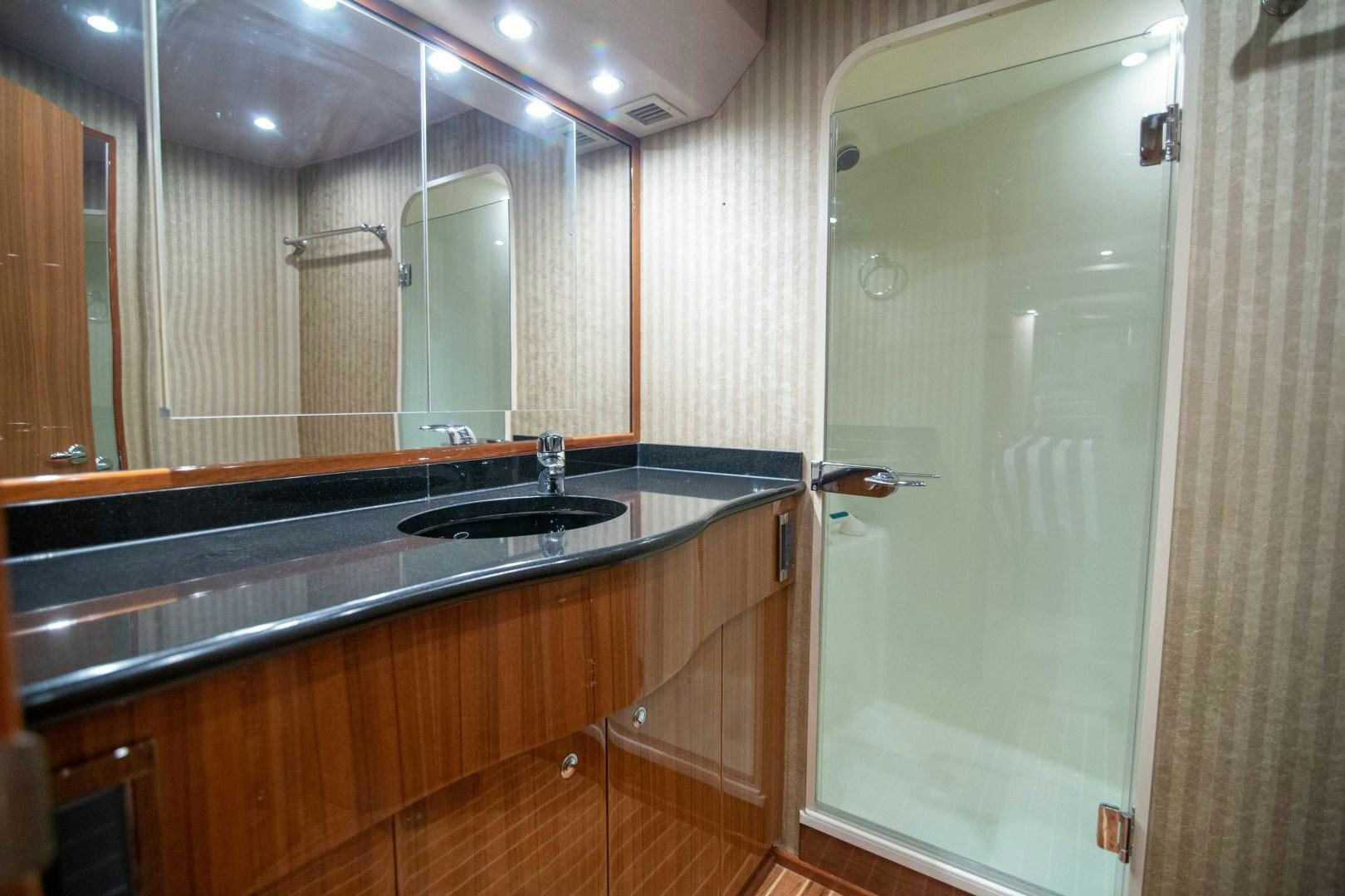 a bathroom with a large mirror aboard LUNA Yacht for Sale