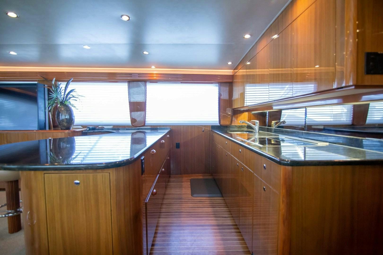 a kitchen with a large island aboard LUNA Yacht for Sale