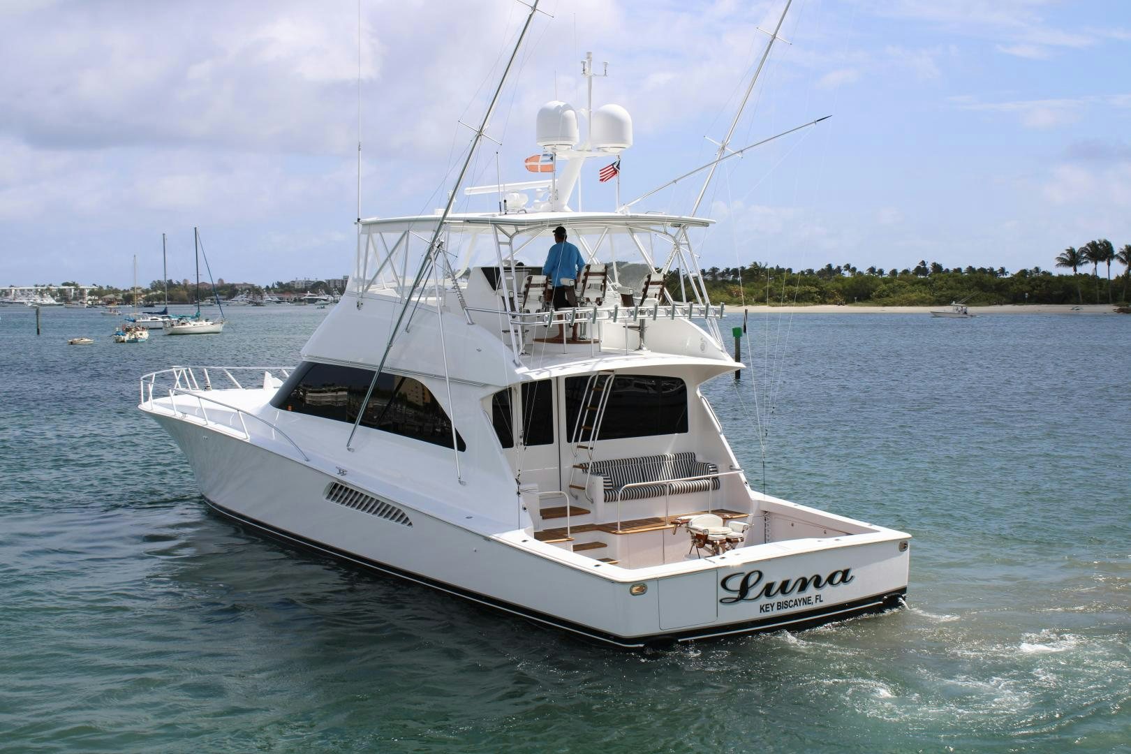 a white boat in the water aboard LUNA Yacht for Sale