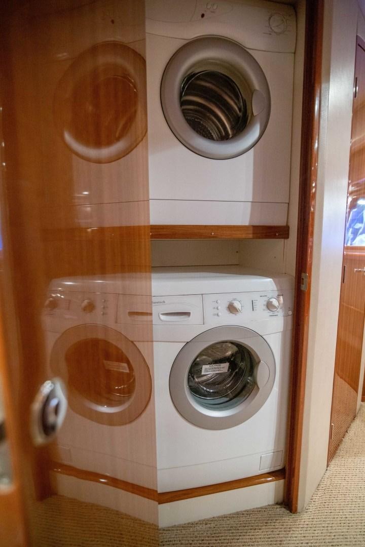 a white washing machine aboard LUNA Yacht for Sale