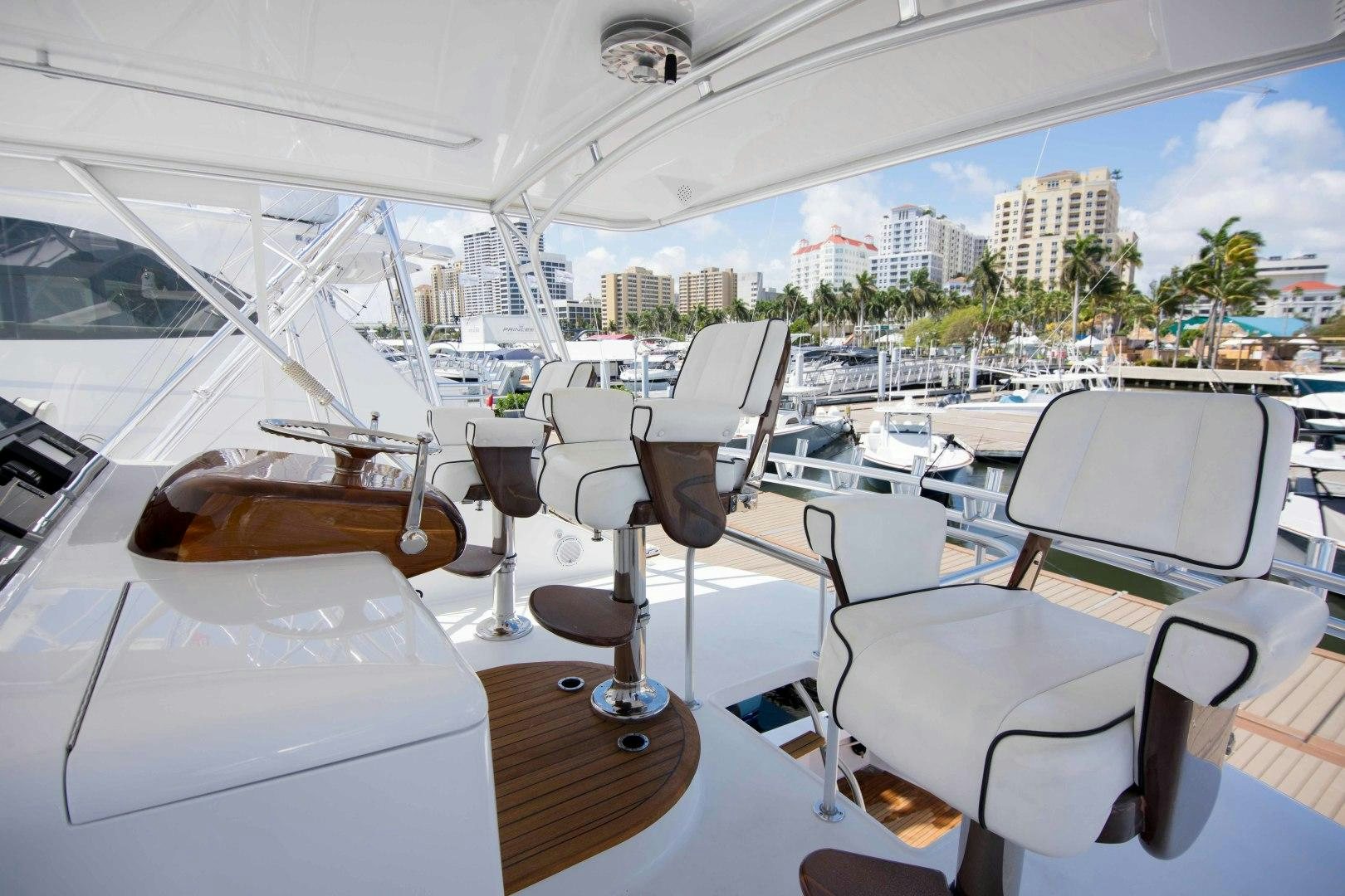 a boat with a table and chairs aboard LUNA Yacht for Sale