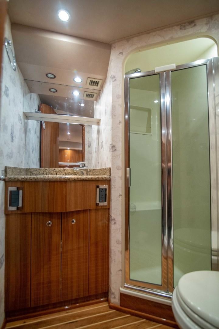a bathroom with a glass shower aboard LUNA Yacht for Sale