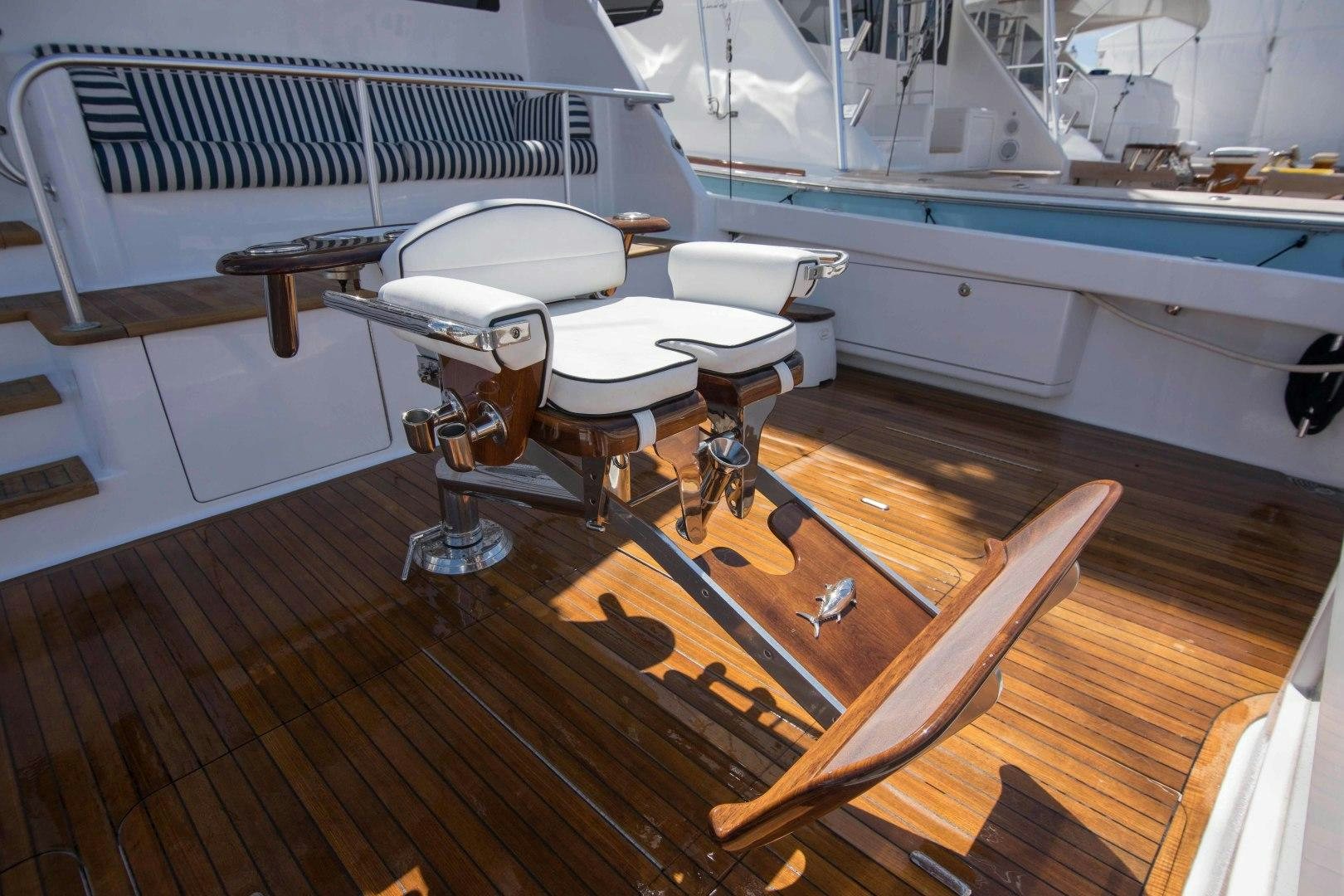 a room with a table and chairs aboard LUNA Yacht for Sale