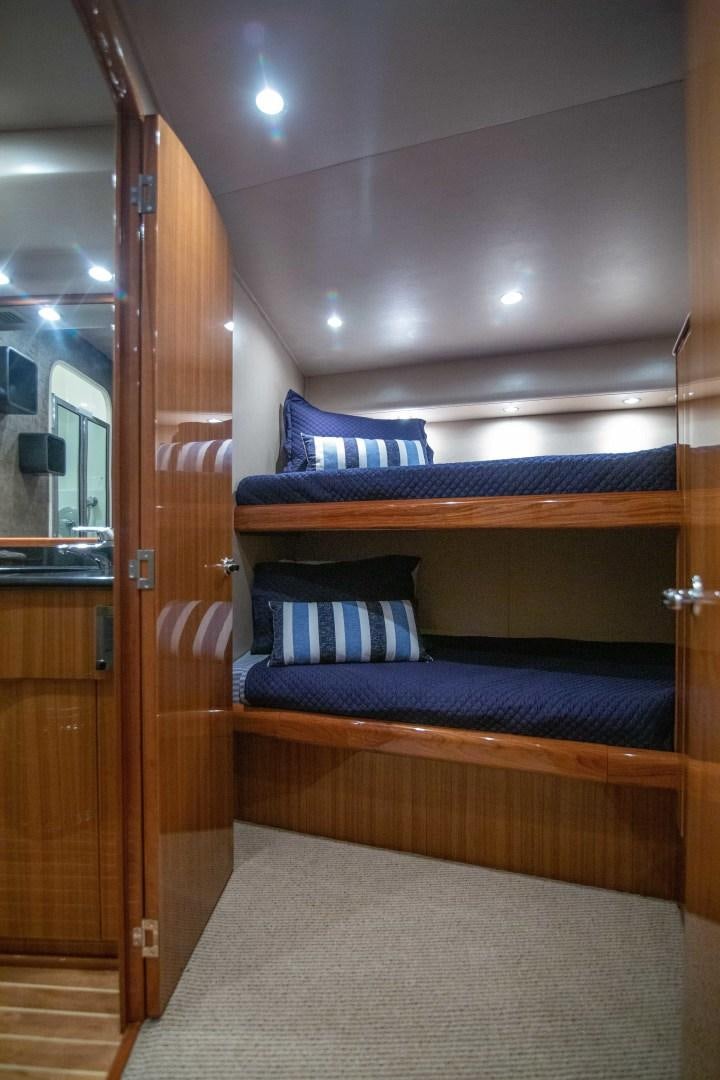 a bed in a room aboard LUNA Yacht for Sale