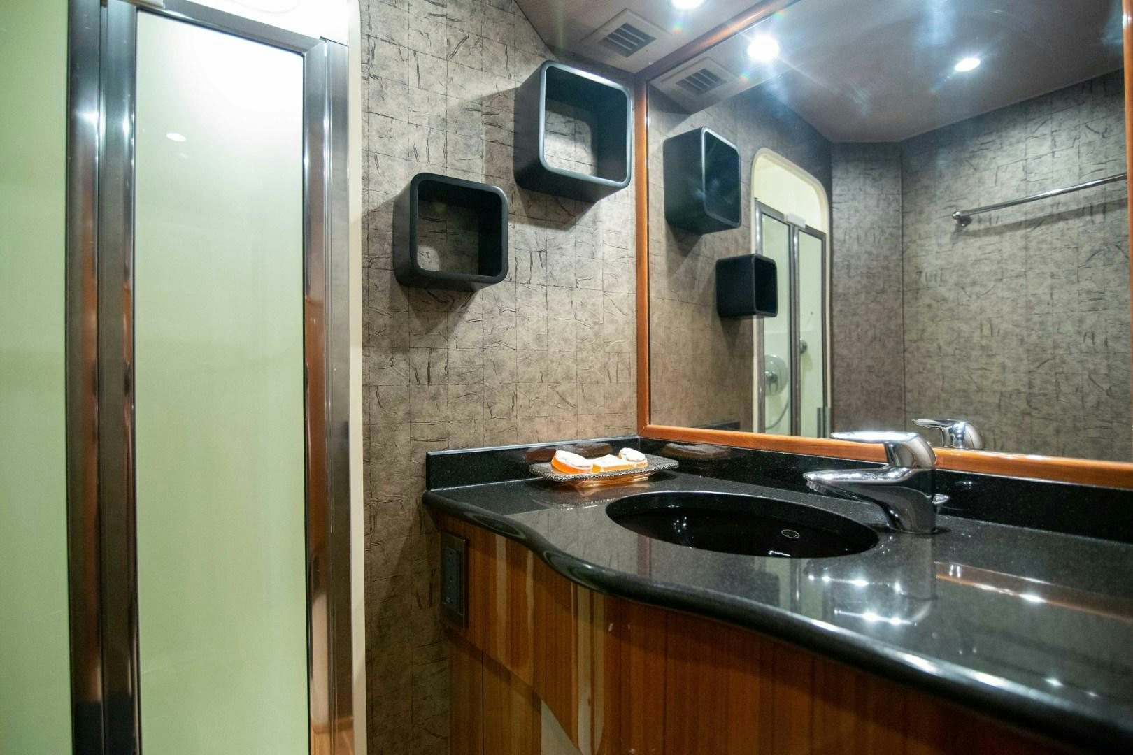 a kitchen with a sink and a microwave aboard LUNA Yacht for Sale
