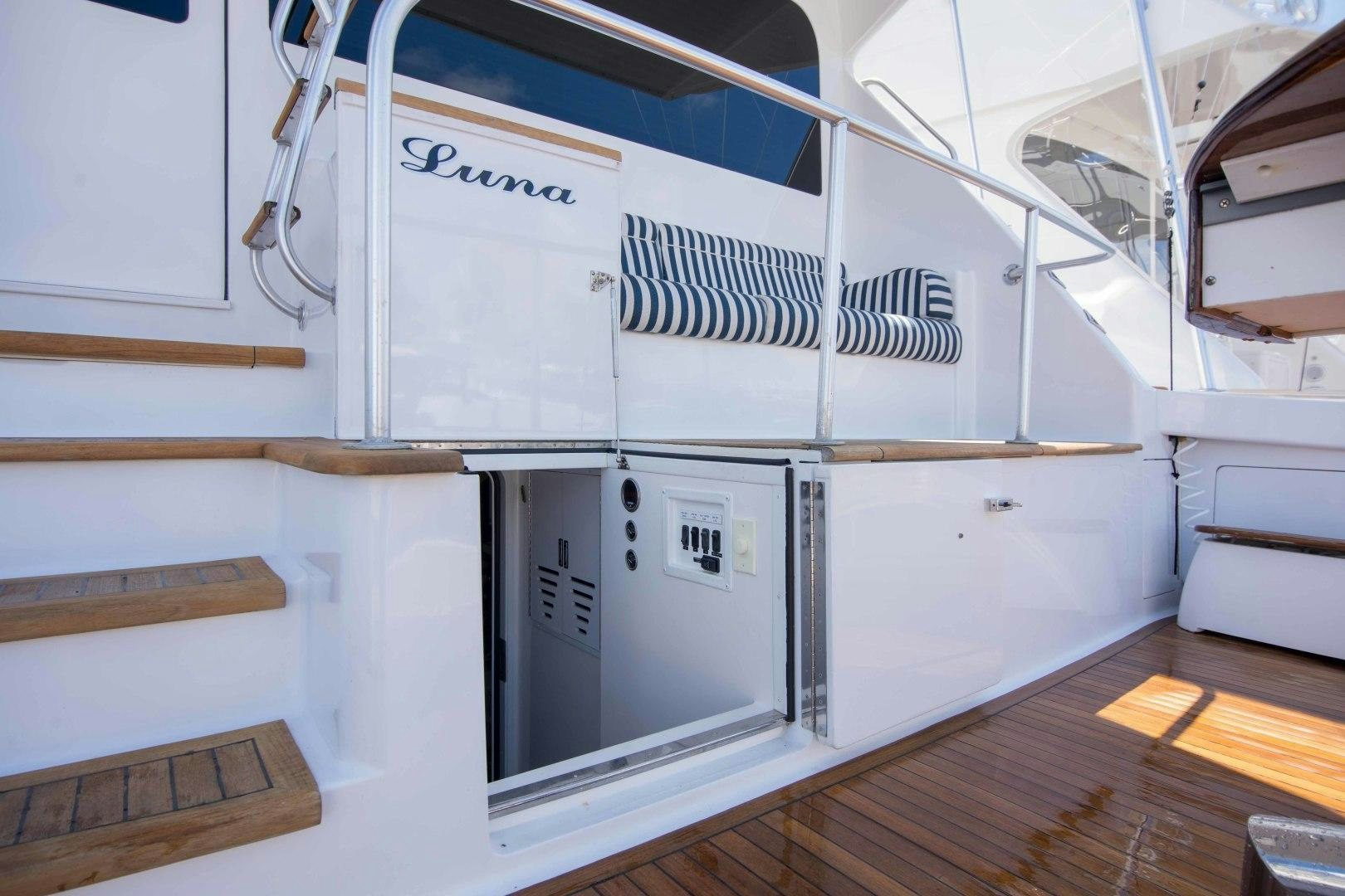 a room with white cabinets aboard LUNA Yacht for Sale