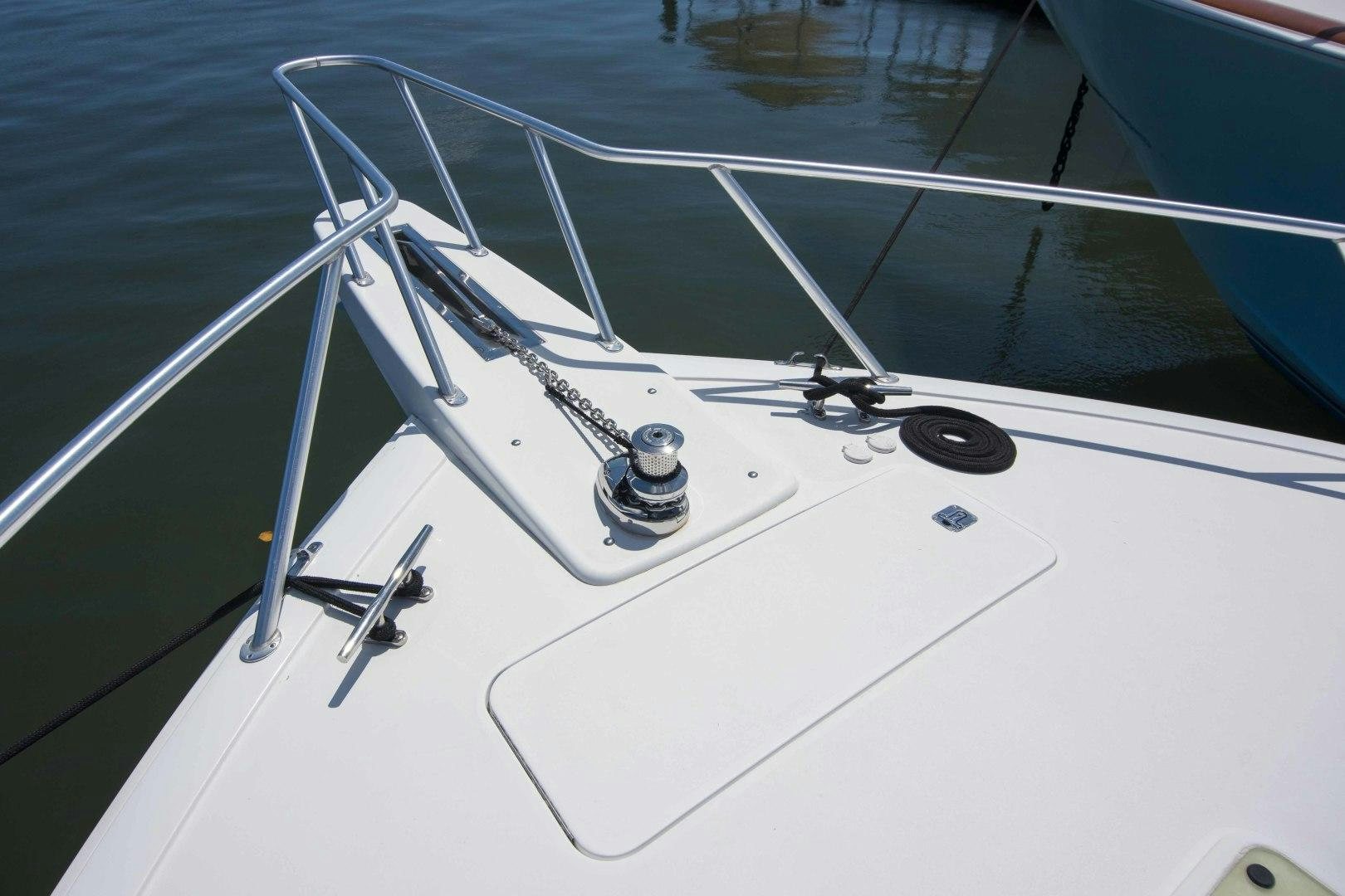 a white boat with a rope attached aboard LUNA Yacht for Sale