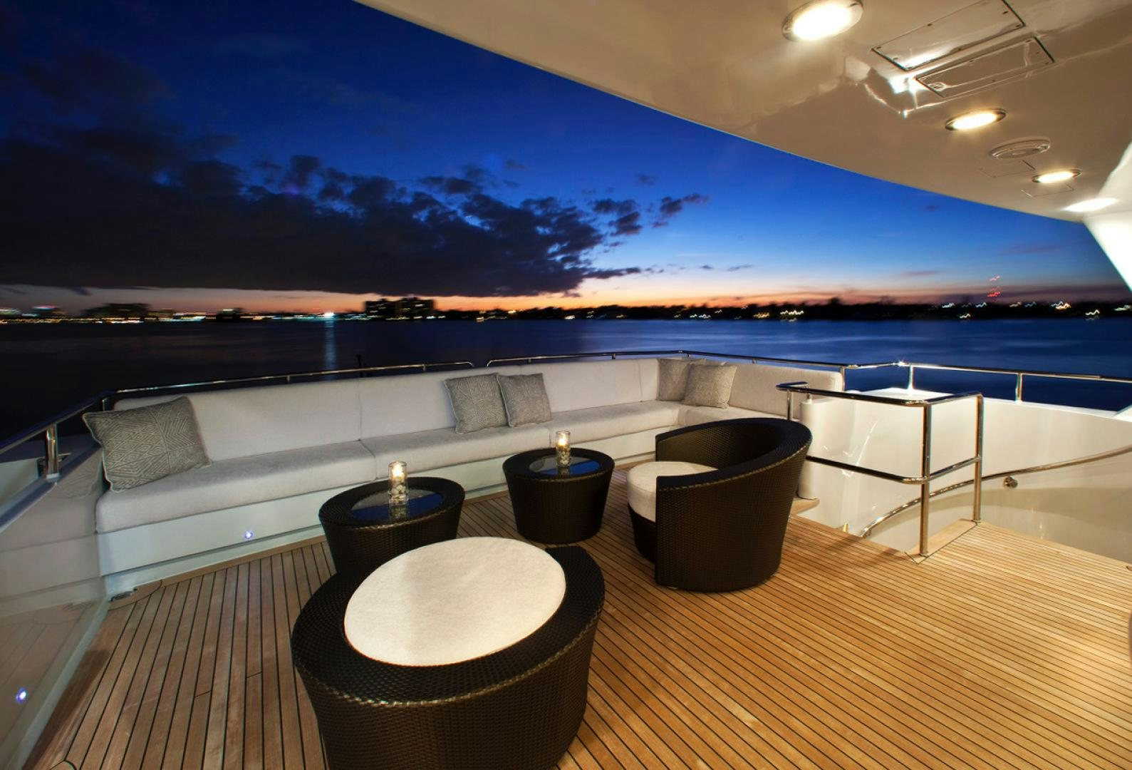 a deck with a view of the ocean and a large pool aboard LEVERAGE Yacht for Charter