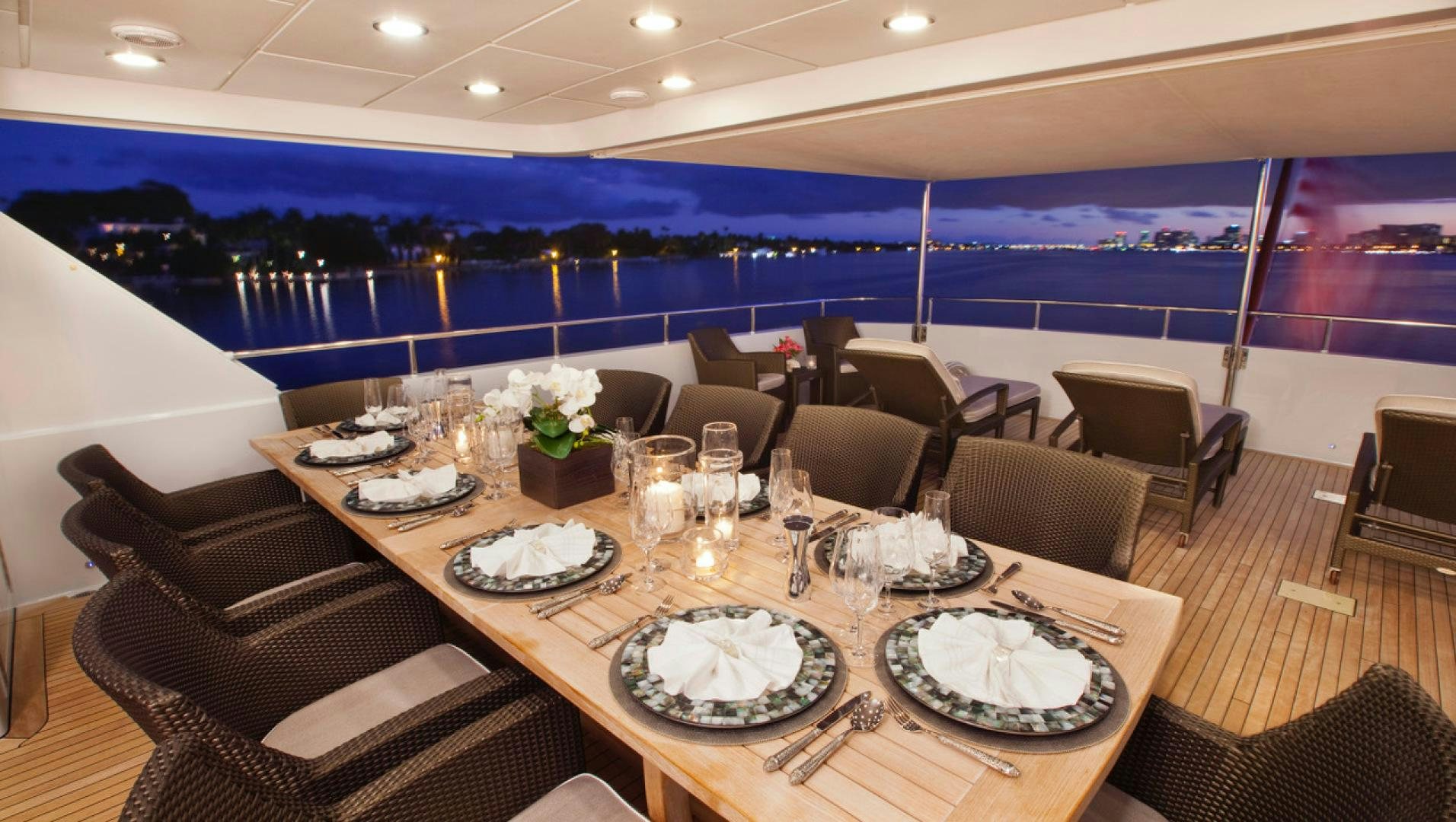 a large room with a table and chairs aboard LEVERAGE Yacht for Sale