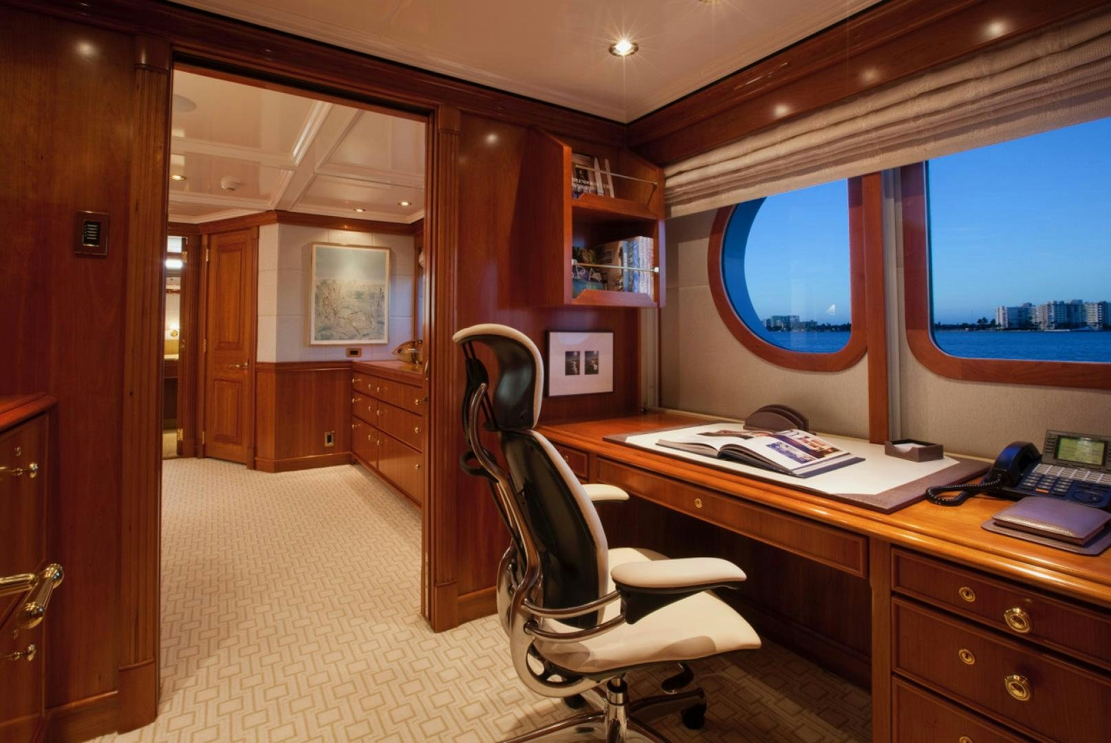 a room with a desk and a window aboard LEVERAGE Yacht for Sale